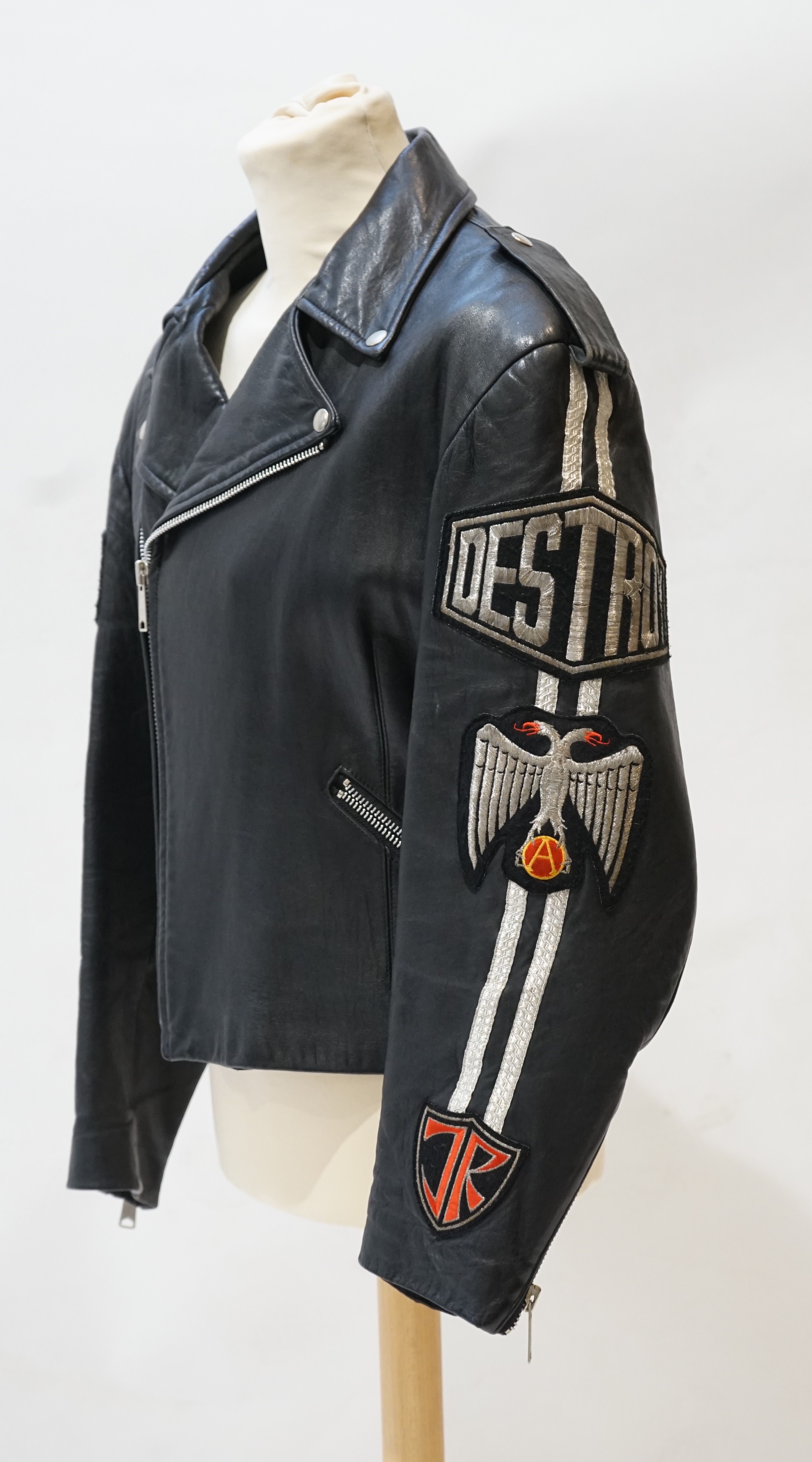 A gentleman's John Richmond black leather biker jacket with 'Destroy' embroidered arms, size L